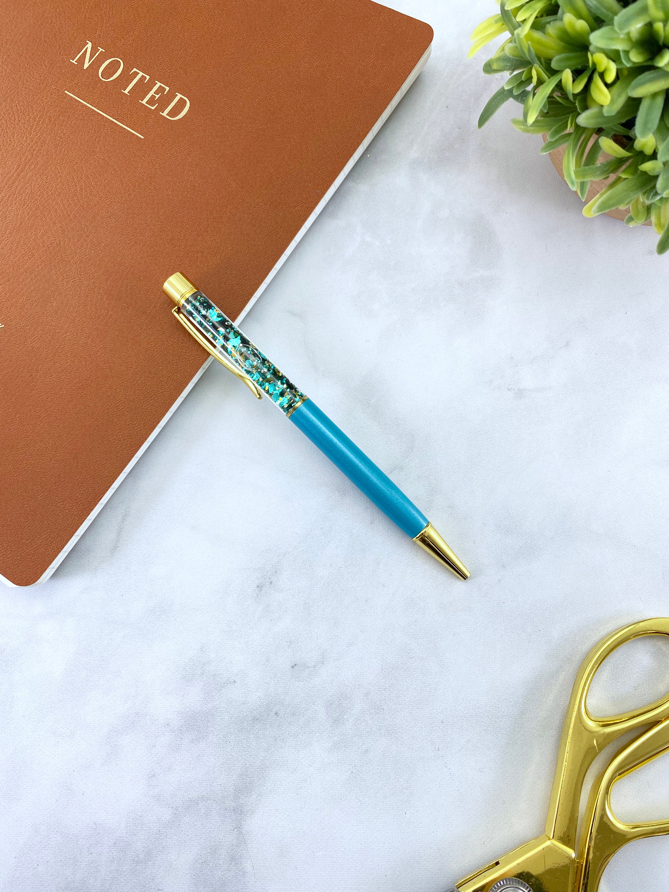 Turquoise Floating Glitter Pen With Gold Hardware 