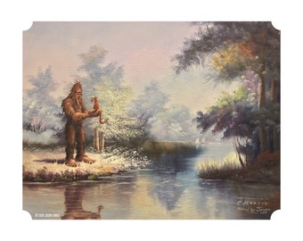 May include: A painting of a Bigfoot holding a small fox in a forest setting. The Bigfoot is brown and furry, and the fox is orange and white. The background is a misty forest with a lake in the distance. The painting is signed "C. Hudson Altered by Jones 2017".