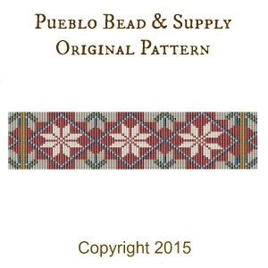 May include: A beaded pattern with a red, white, and blue color scheme. The pattern features a repeating design of white flowers on a red background. The text "Pueblo Bead & Supply Original Pattern" and "Copyright 2015" are also included.
