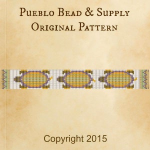 May include: A beaded pattern featuring three stylised turtles in shades of purple, yellow, and green. The pattern is labelled "Pueblo Bead & Supply Original Pattern" and "Copyright 2015".