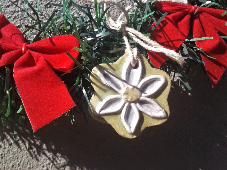 ORNAMENT White and Blue Petals with Yellow Center Ceramic Flower with Lime Green Background