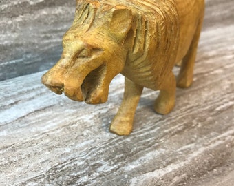 LION.  Approximately 4 inches tall and 8.5 inches long.  Hand carved.  Made in Kenya.