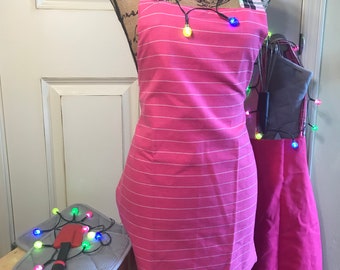 IMANI (Faith) ADULT APRON.  Pink stripes reverses to solid pink.  24-3/4 inches.  Handmade in Kenya.