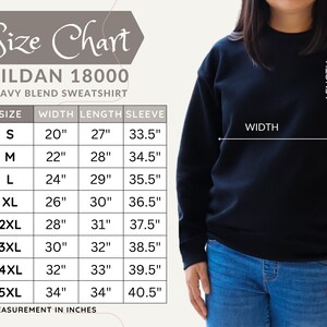 May include: A size chart for a Gildan 18000 heavy blend sweatshirt. The chart shows measurements in inches for sizes S to 5XL. The width ranges from 20" to 34", length from 27" to 34", and sleeve from 33.5" to 40.5".