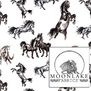 May include: White fabric with a repeating pattern of watercolor-style horses in shades of gray and black. The horses are depicted in various poses, including rearing up and galloping. The Moonlake Fabrics logo is in the bottom right corner.