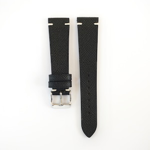 May include: Black leather watch strap with white stitching. The strap has a textured surface and a silver buckle.