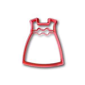May include: A pink plastic cookie cutter shaped like a dress with a bow at the waist.