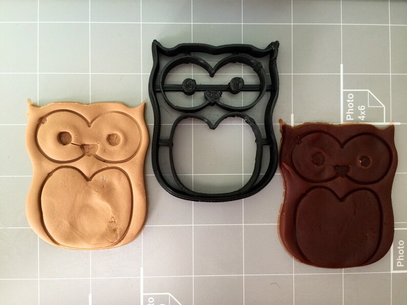 May include: Three owl-shaped cookie cutters, one black plastic, one brown clay, and one tan clay.