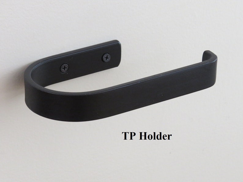Same toilet paper holder with TP loaded. All steel, 1-piece construction with 3/4" bent tip on open end to retain tp. 2 matching screws and drywall anchors to fasten to the wall (included).