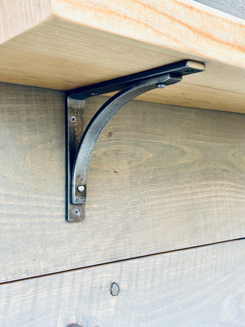 6 inch Station bracket (1 inch wide) mounted on grey pine board with 2 inch thick hemlock shelf...satin clear finish only. Using 6 inch support arm as wall mount.