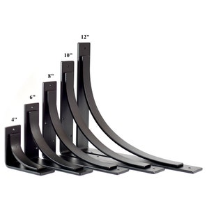 May include: Set of seven black metal shelf brackets in various sizes, ranging from 4 inches to 12 inches. The brackets are curved and have a flat, rectangular base.