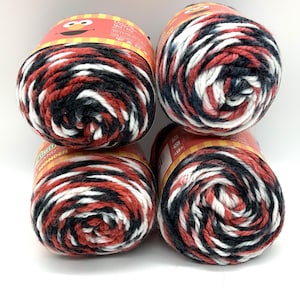YARN 4 pack bundle. Each skein 95 yards 2.5 oz. Red Black White Polyester Print Yarn. Make Mommy & Me or Children&#39;s hats. Yarn only NO HEADS