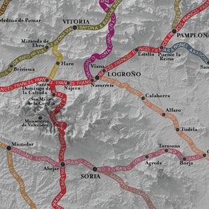 May include: A map of Spain with various cities and towns marked with black dots. The map shows the routes of different historical pilgrimage trails, including the Camino Frances, Camino del Norte, and Camino Aragones. The trails are marked with different colored lines.