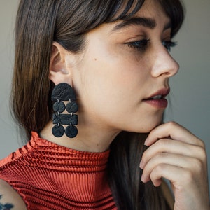 Fray in Black Distressed Leather Texture –  Lightweight Vegan Leather Artisan Clay Earrings for Modern Women – available in clip-on