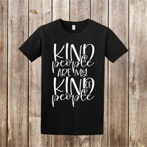 May include: Black t-shirt with white text that reads "Kind people are my kind of people".
