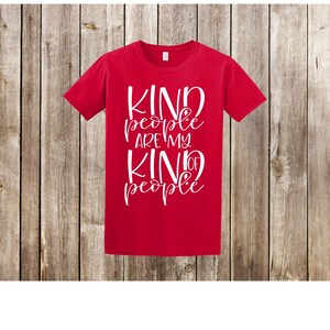 May include: Red t-shirt with white text that reads "Kind people are my kind of people".