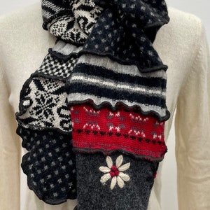Recycled Long wool scarf upcycled from preloved sweaters in blacks and reds. Fabulous embroidered flower. One of a kind wearable art.