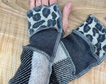 Animal print Arm wrist warmers made from preloved wool and cashmere sweaters in grays and blacks.
