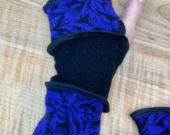 Arm wrist warmers made from preloved wool and cashmere sweaters in blues and greens.