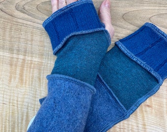 Arm wrist warmers made from preloved wool sweaters.