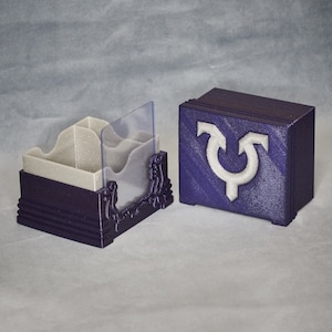 Avacyn - Caja para 100 cartas EDH/COM (120SS) con pantalla frontal de carga superior y ranura adicional para 25 cartas
