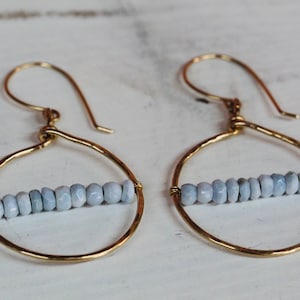 Gold hoops with Boulder Opal. Hammered gold earrings. Hammered hoops with light blue stones. Statement earrings.