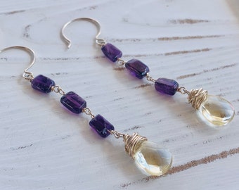 Amethyst and Citrine. Sterling Silver dangle earrings. Amethyst drop earrings. Faceted Citrine. Gold wrapped stones. Wire wrapped earrings.