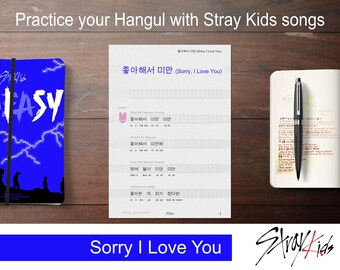 May include: A printable worksheet with a blue and white background featuring the Korean phrase "좋아해서 미안 (Sorry, I Love You)" and a table with lines for writing Hangul characters. The worksheet is titled "Practice your Hangul with Stray Kids songs".
