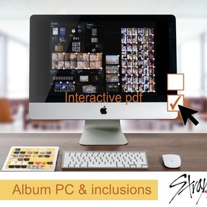 May include: A computer screen displaying an interactive PDF with a grid of images. The text "Interactive pdf" is visible on the screen. A tablet computer is on the desk below the computer screen, displaying a similar grid of images. The text "Album PC & inclusions" is visible below the tablet. The Stray Kids logo is visible in the bottom right corner of the image.