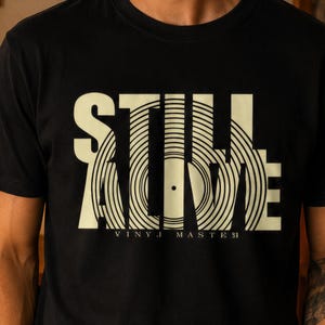 a black t-shirt with a white graphic design on it.