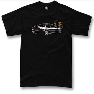 May include: Black t-shirt featuring a white outline of a BMW M3 E46 car and the number "46" in yellow.