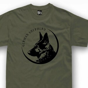 A green t-shirt with a black graphic design depicting the head of a German Shepherd dog.