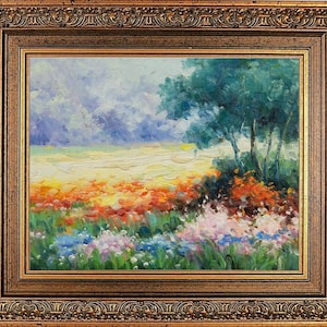 May include: Oil painting of a vibrant landscape with a field of colorful flowers in the foreground. The artwork features a gold ornate frame. The sky is a mix of blues and whites, and trees are on the right side of the painting.