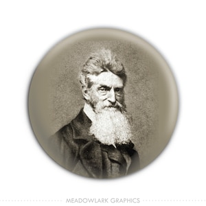 May include: A black and white portrait of a man with a long white beard. He is wearing a dark suit and has a serious expression on his face.