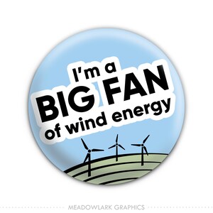 May include: A blue and white button with the text "I'm a BIG FAN of wind energy" and a graphic of three wind turbines.