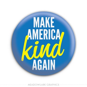 May include: A blue circle button with the text "Make America kind again" in white and yellow lettering.