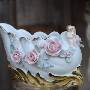 Rococo Cherub Sleigh Planter: Porcelain Christmas Decor