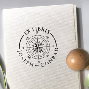 WIND ROSE Personalized Ex Libris Wooden Stamp. Original gift idea for the sailor or sea lover. The illustration shows the marine wind rose with eight cardinal directions on the compass. Around the wind rose image there is a place for the text.