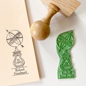 The stamp design is a retro-style hand-drawn illustration. It shows Spherical Sundial Garden Statue.