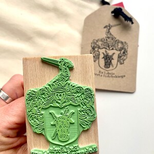 Custom-made Family Crest Stamp mounted on the high-quality wooden handle. Laser engraved rubber of the Coat of Arms Stamp