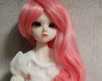 May include: A pink doll wig with long, wavy hair. The wig is made of synthetic fibers and is designed for dolls with a 1/3 scale.