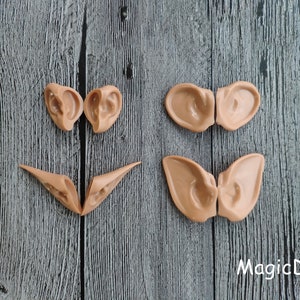 May include: Three pairs of elf ears made of a flexible, skin-toned material. The ears are designed to be attached to the head for a costume or cosplay.