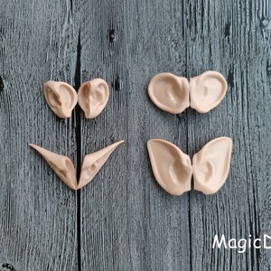 May include: Four pairs of elf ears made of a flexible, skin-toned material. The ears are designed to be attached to the head for a costume or cosplay.