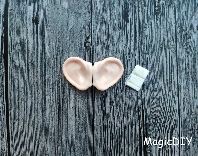 May include: Two flesh-colored, silicone elf ears with a white adhesive strip for attaching them to the head.