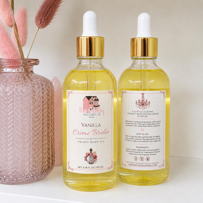 May include: Two clear glass dropper bottles filled with yellow body oil. The front label reads Vanilla Cr&egrave;me Br&ucirc;l&eacute;e + Velvet Body Oil, 3.38 FL OZ (100 ML). The back label features text including A Little Luxury and ingredients list.