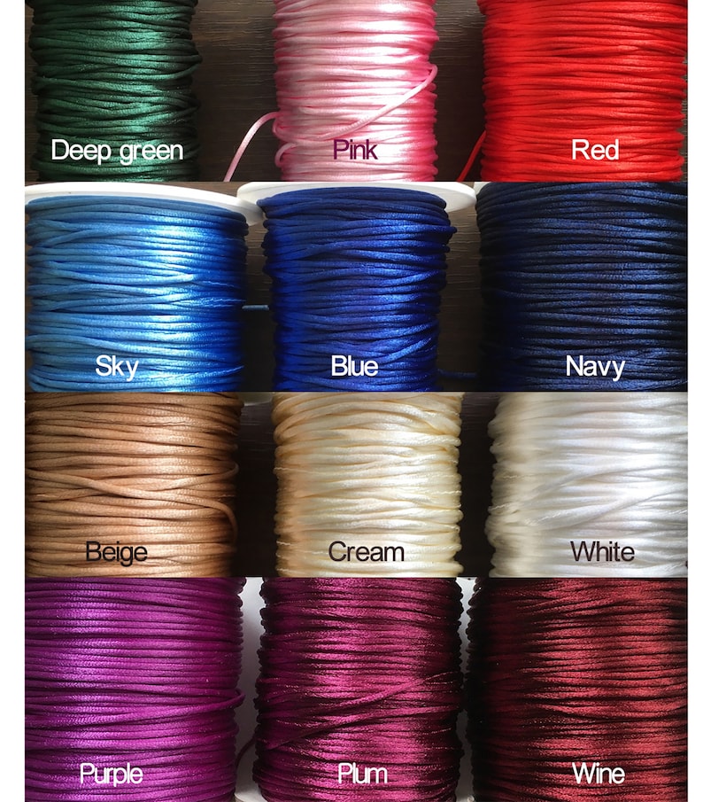 May include: Twelve spools of waxed cotton cord in various colors, including deep green, pink, red, sky blue, blue, navy, beige, cream, white, purple, plum, and wine.