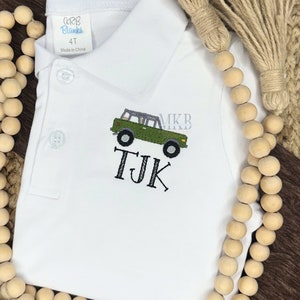 May include: White polo shirt with a green jeep and the initials "TJK" embroidered on the front. The shirt is size 4T and made in China.