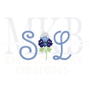 May include: Blue and white embroidered letters "S" and "L" with a bluebonnet flower in between. The letters are surrounded by the text "MKB Embroidery Designs".