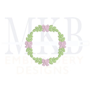 May include: A green wreath with pink bows. The wreath is a circle with leaves and bows around the edge.