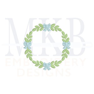 May include: A green wreath with blue bows, ideal for a monogram or initial. The wreath is a classic design with a simple, elegant look.